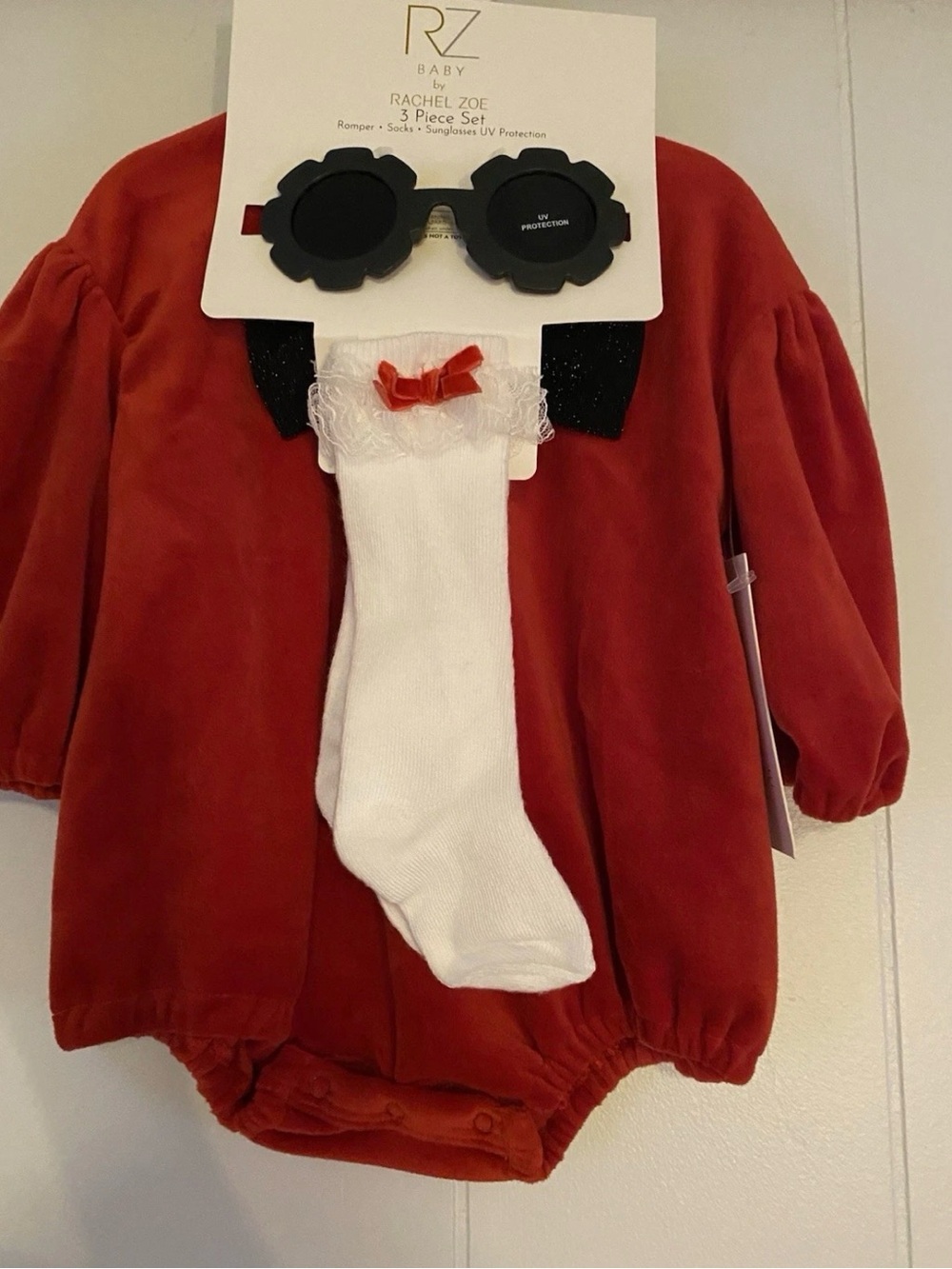 Rachel Zoe Red Velvet Baby Romper Set with White Socks and Black Sunglasses